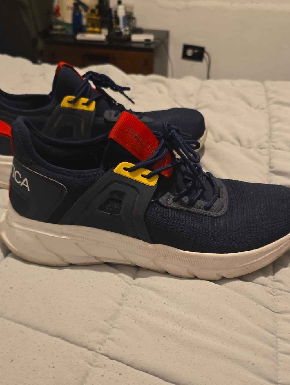 Nautica Men’s Navy Blue Athletic Sneakers with Red & Yellow Accents